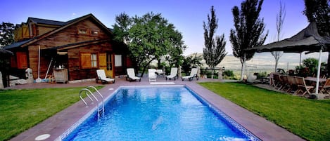 Indoor pool, outdoor pool, pool umbrellas, pool loungers