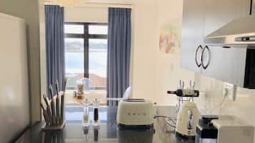 Appartement Exécutif | Cuisine privée | Réfrigérateur, micro-ondes, four, plaque de cuisson
