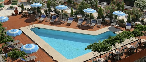Seasonal outdoor pool, open 10:30 AM to 7:00 PM, sun loungers