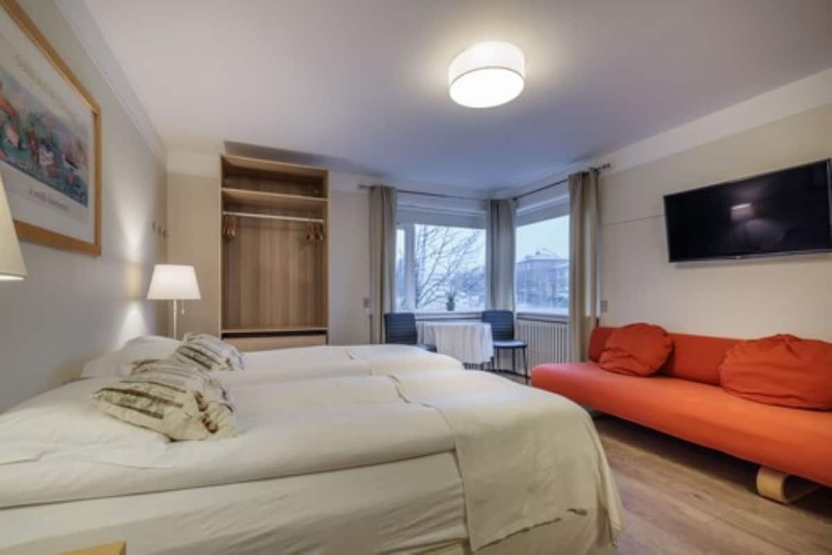 Classic Triple Room | Desk, laptop workspace, blackout drapes, iron/ironing board (on request)
