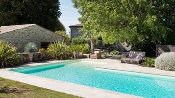 Outdoor pool, open 10:00 AM to 7:00 PM, pool umbrellas, pool loungers