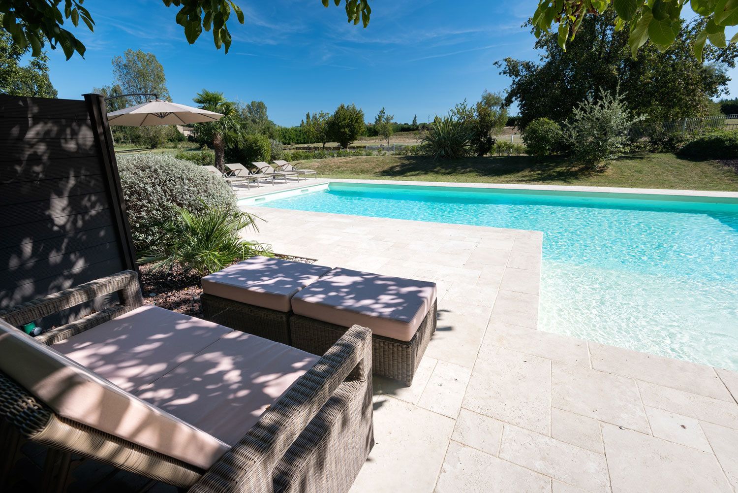 Outdoor pool, open 10:00 AM to 7:00 PM, pool umbrellas, pool loungers