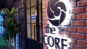 A brick wall with a sign reading "the CORE HOTEL". - The Core Hotel (Subang Jaya)