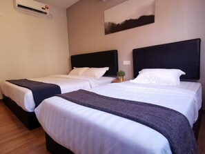 Deluxe Triple Room, Multiple Beds | Soundproofing, iron/ironing board, free WiFi, bed sheets - The Core Hotel (Subang Jaya)
