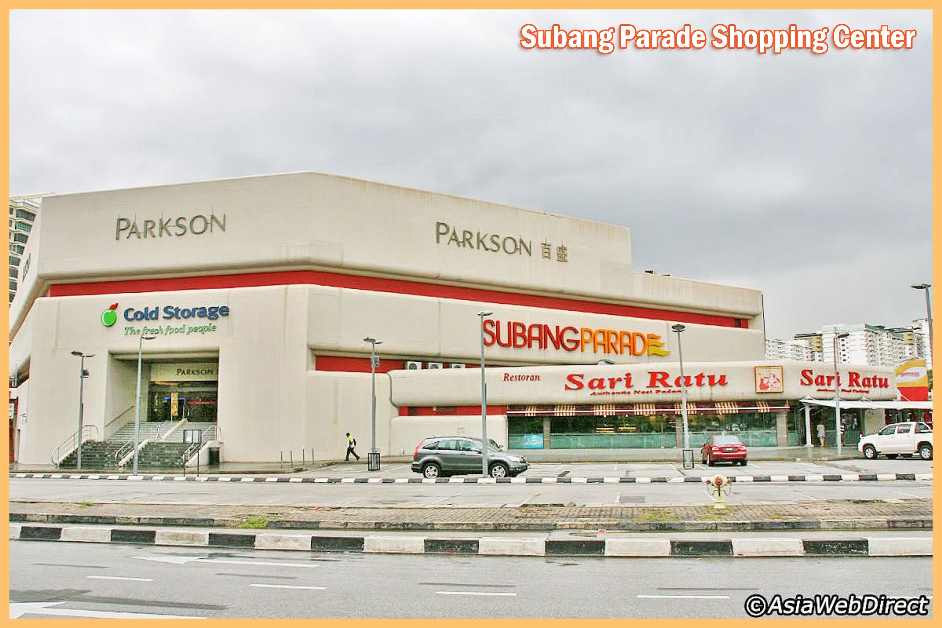 A shopping center with a large parking area, a cold storage facility, and multiple food outlets including Sari Ratu.