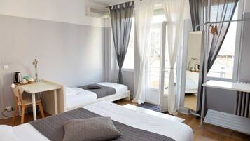 Triple Room | Individually decorated, individually furnished, desk, blackout curtains