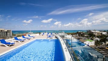 Outdoor pool, open 8:00 AM to 7:00 PM, pool loungers