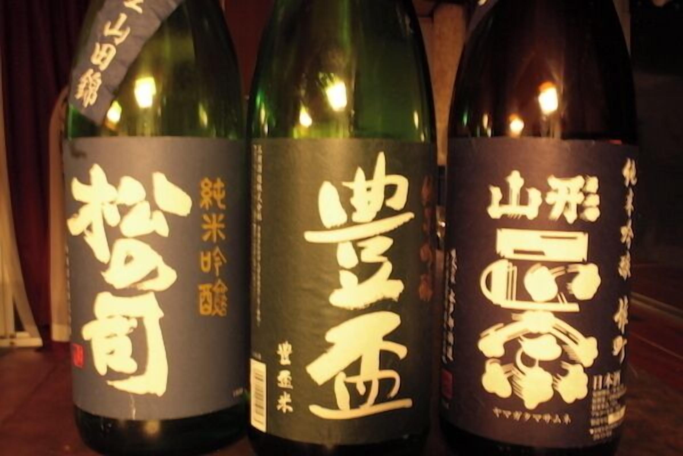 Three bottles with labels.