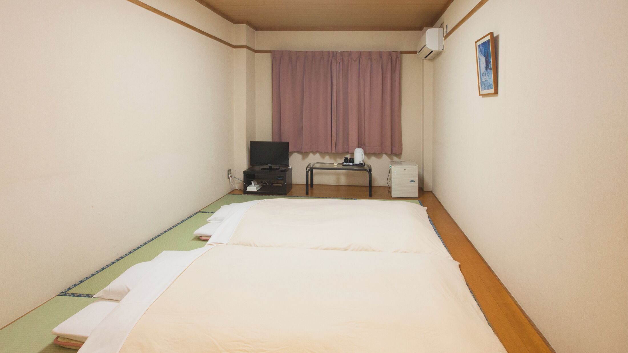Down duvets, desk, laptop workspace, blackout curtains