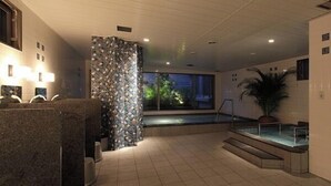 A modern bathroom with a marble vanity, a patterned wall, a small pool, and a staircase leading to a balcony. - Toyooka Green Hotel Morris (Toyooka)