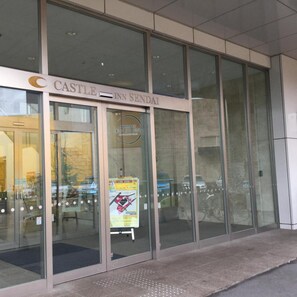 The entrance to Castle Inn Sendai with large glass doors and a visible sign. - Castle Inn Sendai (Sendai)