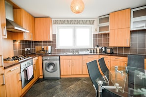 Enjoy cooking in this well-lit kitchen with ample workspace and a central island.