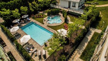 Seasonal outdoor pool, open 8:00 AM to 11:00 PM, pool umbrellas
