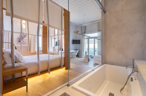 Designer toiletries, hair dryer, bathrobes, slippers