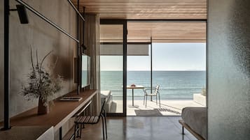 Seaview Terrace Suite | Minibar, in-room safe, individually decorated, individually furnished