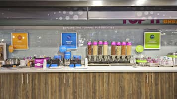 A breakfast bar with various food options and condiments.