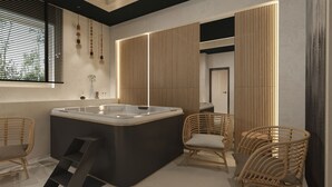 A modern bathroom with a freestanding bathtub, wicker chairs, and a wooden panel wall. - Willa u Anusia Jacuzzi & Sauna (Zakopane)