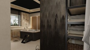 A modern bathroom with a freestanding bathtub, a wooden chair, and a towel rack.