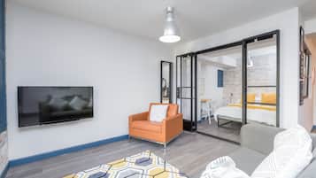 Studio, 1 Double Bed with Sofa bed | Living area | Flat-screen TV