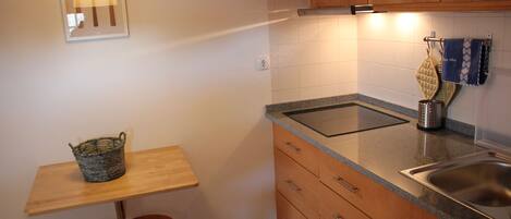 Fridge, microwave, stovetop, coffee/tea maker