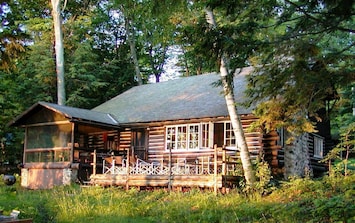 Historic log cabin lakeside view with Deck & Screen Porch