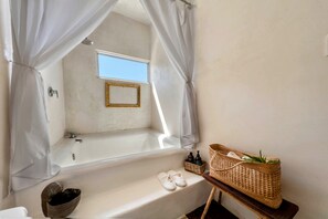 Combined shower/tub, hair dryer, towels, soap