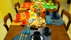 A dining table set with various dishes, drinks, and utensils. - L'Antica Torre Caralis Holiday (Cagliari)