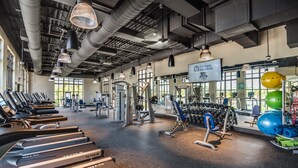A gym with treadmills, weight machines, and exercise balls. - Solara Resort Exec Villas- 1542cpc (Kissimmee)