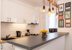 Fridge, microwave, stovetop, coffee/tea maker