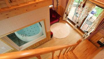 Duplex, Jetted Tub (17 PY Bubble Spa Room) | Living area | Flat-screen TV