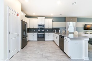 House, Multiple Beds | Private kitchen