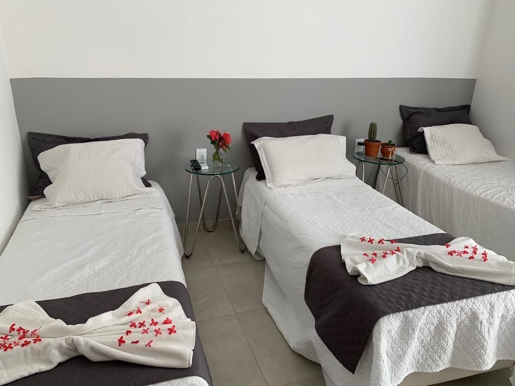 Premium Triple Room, Multiple Beds, Pool View | Minibar, individually decorated, individually furnished, desk