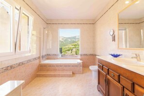 Bathtub, hair dryer, towels