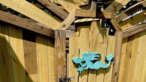 A wooden gate with a latch and a decorative metal emblem. - West Dennis Central - 5 bed, 3 bath, 2 kitchen huge yard!
Two hot tubs! (Dennis)