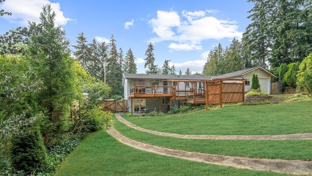 A two-story house with a wooden deck and a fenced backyard. - Long Term Stay Discount. Business, Couples and Families Welcome/Ground Floor (Bothell)