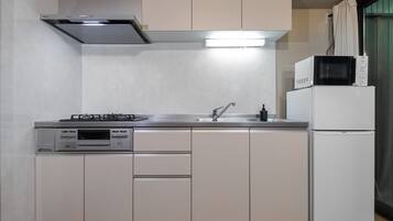 Fridge, microwave, cookware/dishes/utensils