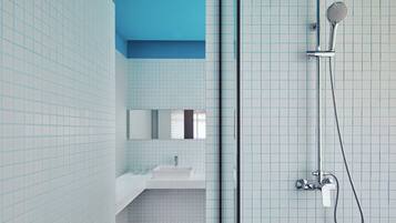 Studio 55 | Bathroom | Shower, free toiletries, slippers, towels