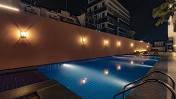 Outdoor pool, open 7:00 AM to 7:00 PM, pool loungers