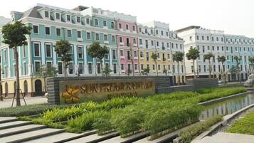 A multi-story building with a sign reading "SUN PREMIER VILLAGE."