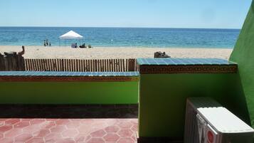 On the beach, sun-loungers
