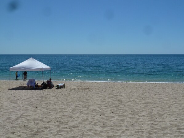 On the beach, sun-loungers