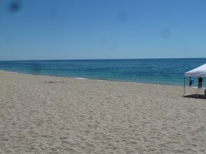 On the beach, sun loungers