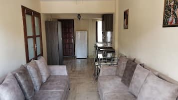Family Apartment, 1 Queen Bed, Accessible | Living room | LCD TV