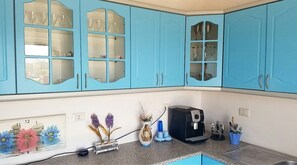 Fridge, coffee/tea maker, cookware/dishes/utensils