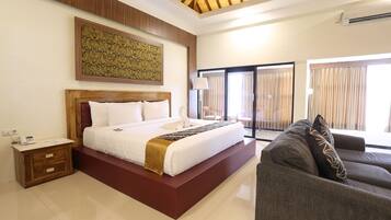 A modern bedroom with a large bed, a wooden headboard, a bedside table with a phone, and a large window with curtains.