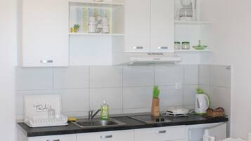 Apartment, Sea View | Private kitchen | Fridge, oven, stovetop, electric kettle