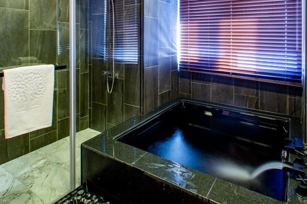 Bathroom | Shower, hair dryer, bathrobes, slippers