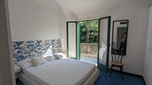 1 bedroom, desk, iron/ironing board, travel crib