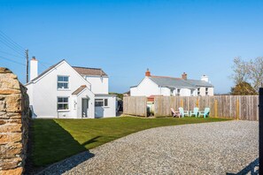 Exterior - Curlew Cottage, Cubert, with glimpses of the sea (Cubert)