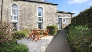 A stone building with a paved pathway leading to a door. - The Organ Loft - Two Bedroom Cottage, Sleeps 4 (England)